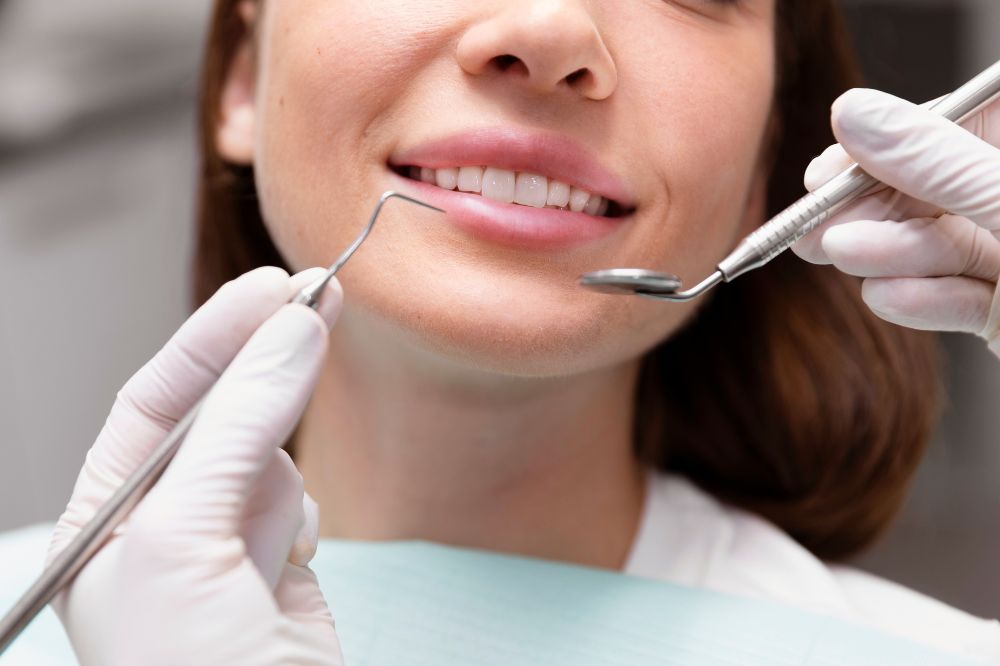 a woman is getting dental treatment.