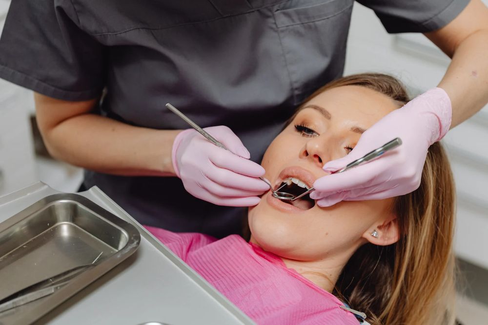 dentist teaching gentle toothbrushing technique